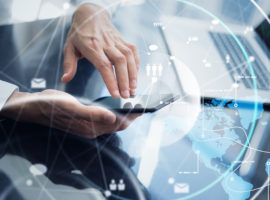 Businessman working remotely. Concept of networking or remote work. Global business network. Close-up of male hands with smartphone